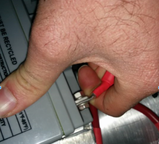Trying to wiggle the battery terminal by hand.