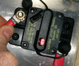 Applying a twisting force to the second cable on the breaker.